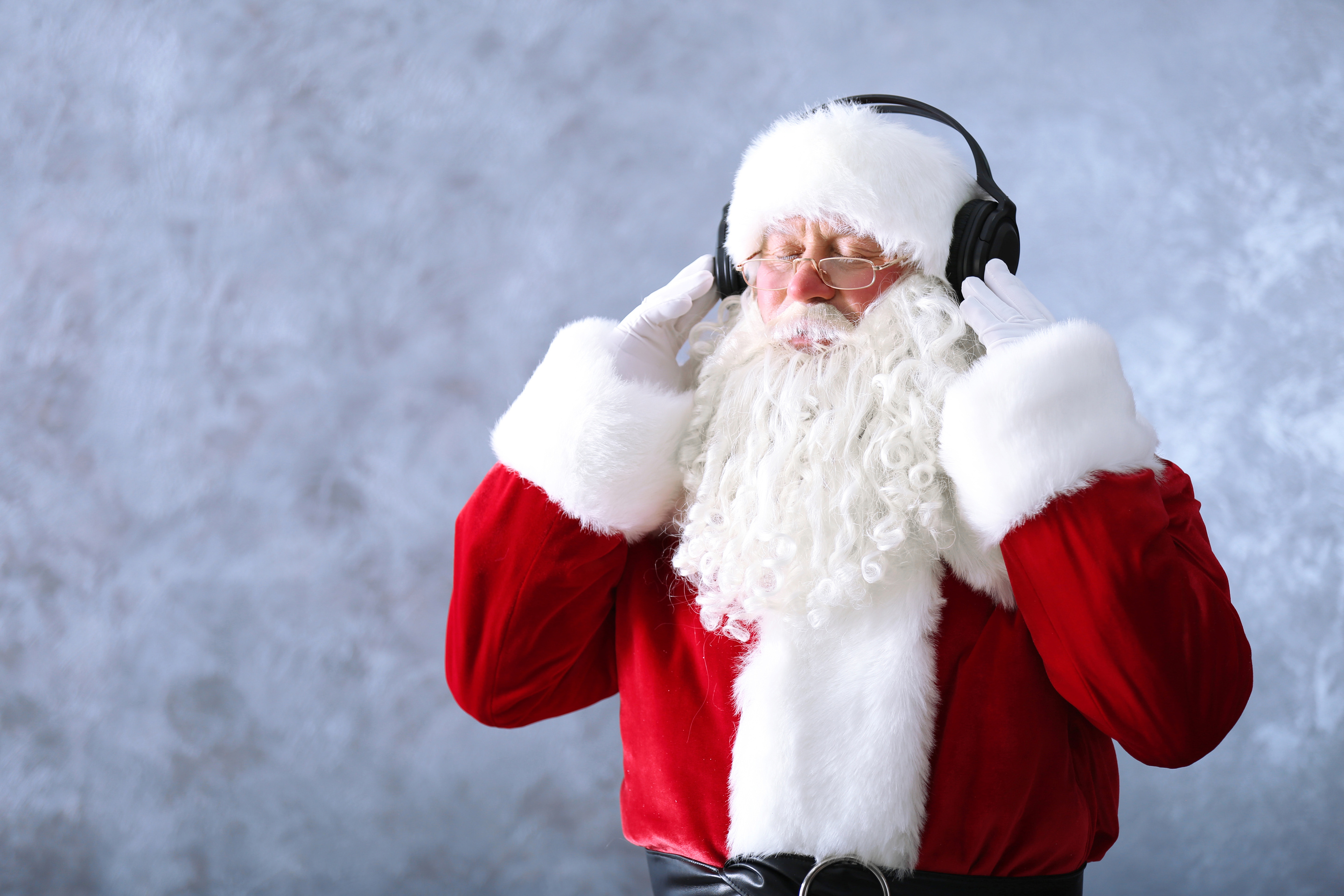 Santa Claus with Headphones Listening to Music